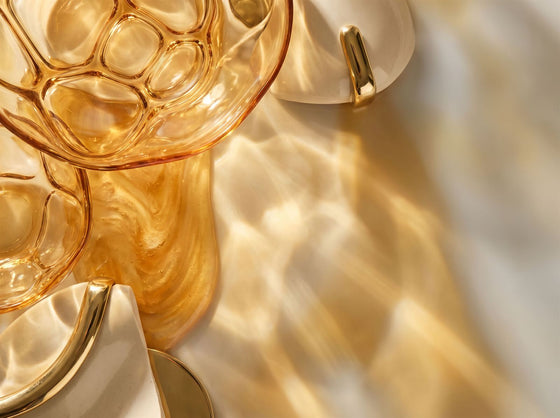 Golden light through amber glass — cellular energy