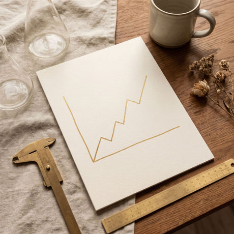 A rising gold line chart beside lab glassware